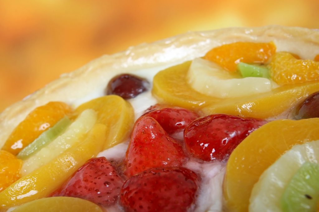 fruit cake with glaze fruits on top